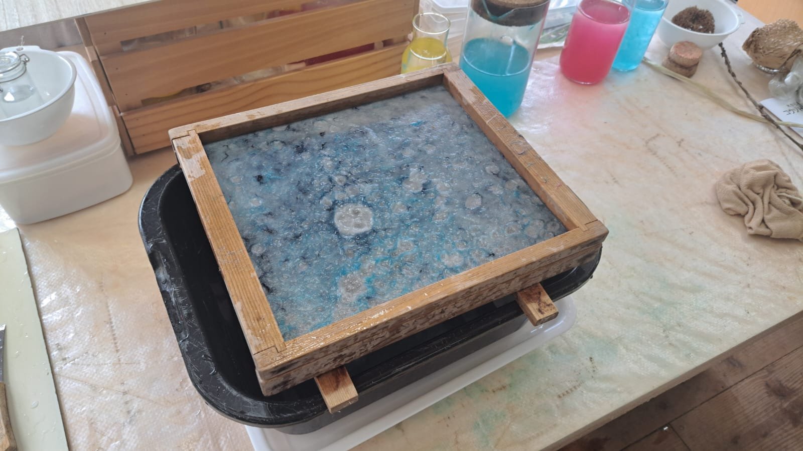 Blue pulp on mould with coloured inks