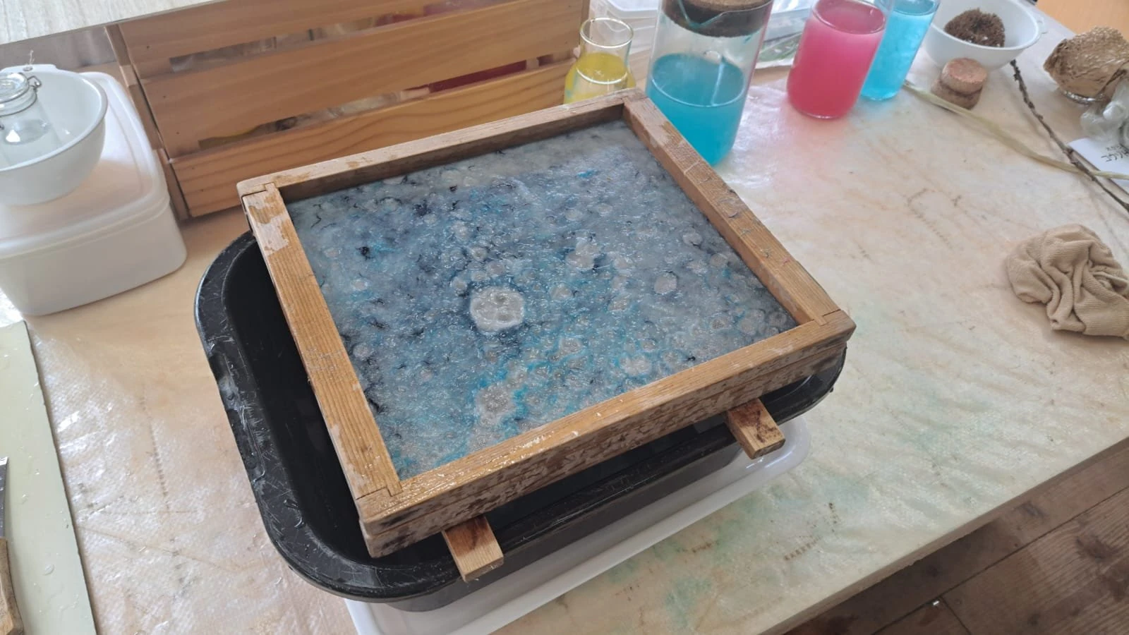 Blue pulp on mould with coloured inks